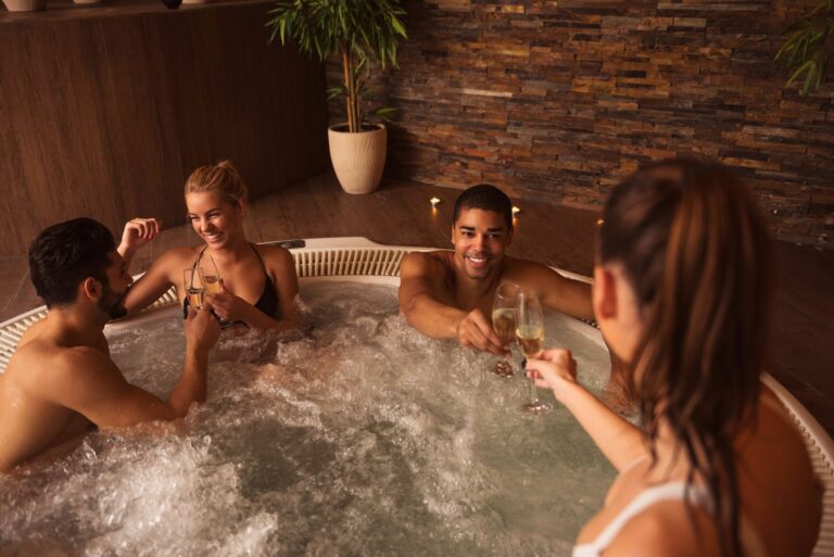 a group of people in a marquis hot tub